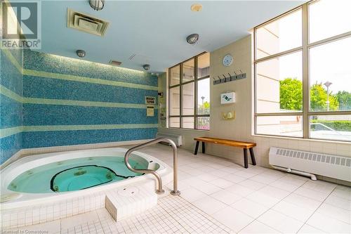 View of swimming pool with an indoor hot tub - 2379 Central Park Drive Unit# 206, Oakville, ON - Indoor Photo Showing Other Room