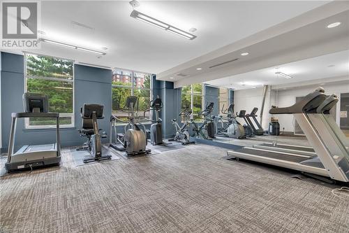 Gym featuring a wall of windows and carpet floors - 2379 Central Park Drive Unit# 206, Oakville, ON - Indoor Photo Showing Gym Room