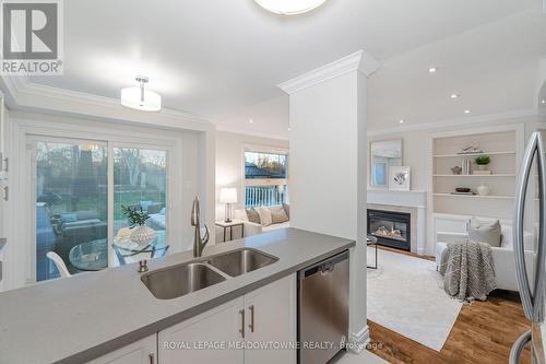 1344 Godwick Drive, Mississauga, ON - Indoor Photo Showing Kitchen With Fireplace With Double Sink