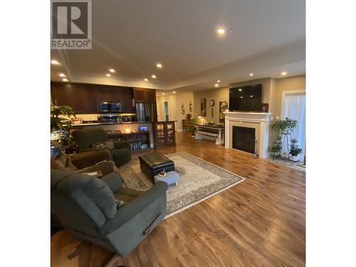 18 4022 Yeo Street, Terrace, BC - Indoor Photo Showing Living Room With Fireplace