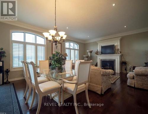 10 - 68 Fairview Drive, Brantford, ON - Indoor Photo Showing Dining Room With Fireplace