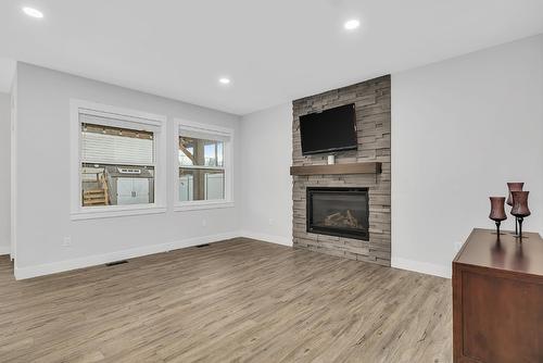 1938 Hemmerling Court, Kelowna, BC - Indoor Photo Showing Living Room With Fireplace