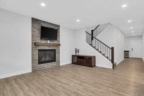 1938 Hemmerling Court, Kelowna, BC - Indoor Photo Showing Living Room With Fireplace