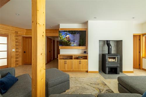 8100, 8104 Silver Star Road, Vernon, BC - Indoor Photo Showing Living Room With Fireplace