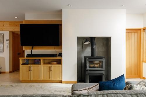 8100, 8104 Silver Star Road, Vernon, BC - Indoor Photo Showing Living Room With Fireplace