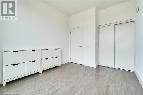 Unfurnished bedroom with a closet and light wood-type flooring - 15 Prince Albert Boulevard Unit# 610, Kitchener, ON - Indoor Photo Showing Other Room