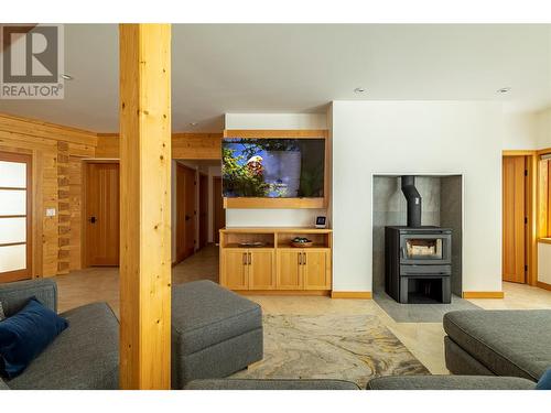 8100, 8104 Silver Star Road, Vernon, BC - Indoor Photo Showing Living Room With Fireplace