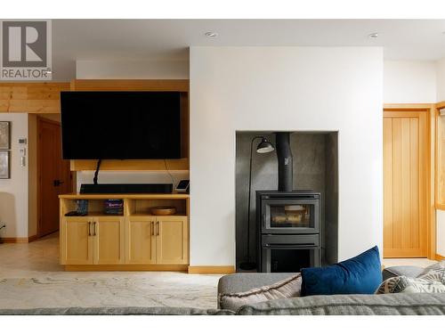 8100, 8104 Silver Star Road, Vernon, BC - Indoor Photo Showing Living Room With Fireplace