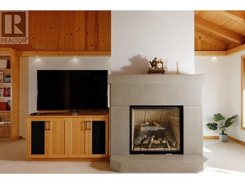 8100, 8104 Silver Star Road, Vernon, BC - Indoor Photo Showing Living Room With Fireplace