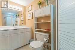 Bathroom with walk in shower, vanity, and toilet - 