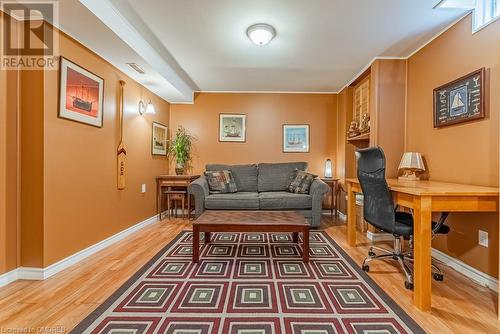 Office with dark wood-type flooring and ornamental molding - 2080 Sixth Line, Oakville, ON - Indoor