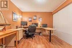 Home office with light wood-type flooring - 