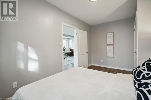 Bedroom with dark hardwood / wood-style flooring - 59 Stanley Street, Brantford, ON - Indoor Photo Showing Bedroom