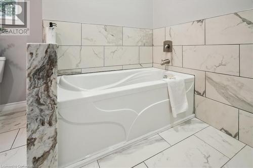 Bathroom with a bathtub - 59 Stanley Street, Brantford, ON - Indoor Photo Showing Bathroom