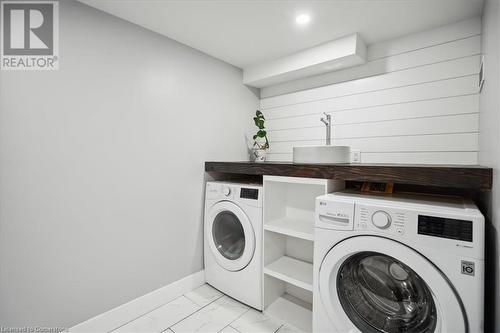 Clothes washing area featuring separate washer and dryer - 59 Stanley Street, Brantford, ON - Indoor Photo Showing Laundry Room