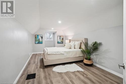 Bedroom featuring hardwood / wood-style flooring and vaulted ceiling - 59 Stanley Street, Brantford, ON - Indoor Photo Showing Bedroom