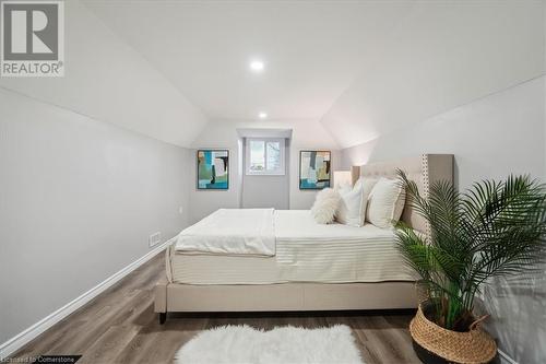 Bedroom featuring hardwood / wood-style flooring and vaulted ceiling - 59 Stanley Street, Brantford, ON - Indoor Photo Showing Bedroom