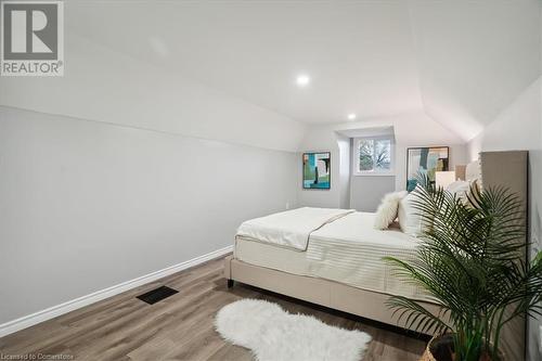 Bedroom featuring hardwood / wood-style flooring and vaulted ceiling - 59 Stanley Street, Brantford, ON - Indoor Photo Showing Bedroom