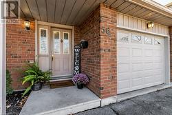 View of exterior entry featuring a garage - 