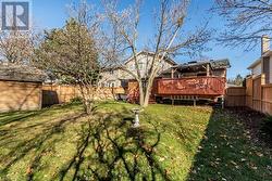 View of yard with a gazebo and a deck - 