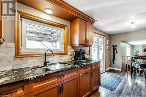 Kitchen with new counters, sink, new floors, and backsplash - 56 Imperial Road N, Guelph, ON - Indoor Photo Showing Kitchen With Double Sink