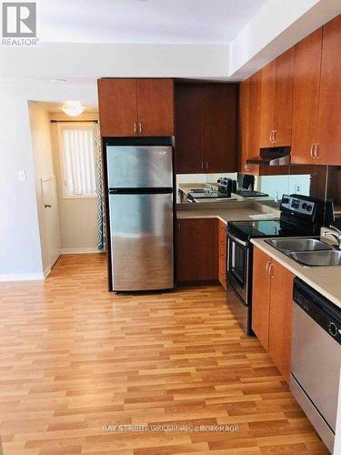 143 - 60 Fairwood Circle, Brampton, ON - Indoor Photo Showing Kitchen With Double Sink