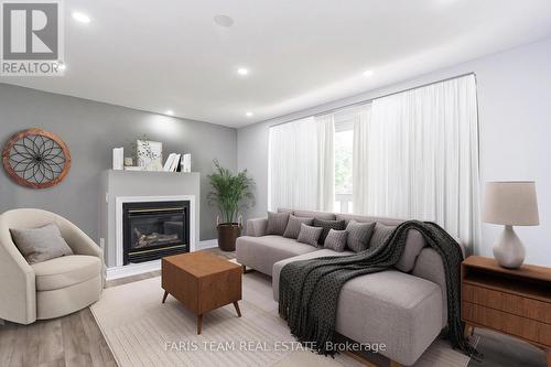 39 Brackenbury Street, Grey Highlands, ON - Indoor Photo Showing Living Room With Fireplace