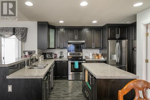 6733 Checkley Road, Prince George, BC - Indoor Photo Showing Kitchen With Double Sink With Upgraded Kitchen