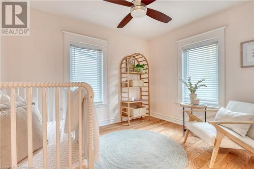 Living area featuring ceiling fan, a healthy amount of sunlight, and light hardwood / wood-style flooring - 262 Homewood Avenue, Hamilton, ON - Indoor