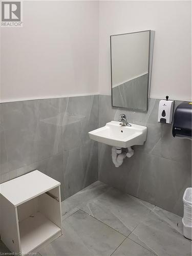 Bathroom with sink and tile walls - 509 Wilson Avenue Unit# 17A, Kitchener, ON 