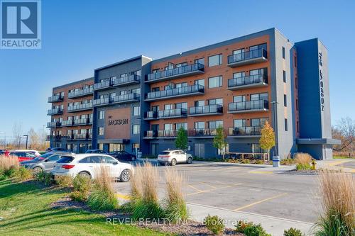 408 - 64 Main Street N, Haldimand, ON - Outdoor With Balcony With Facade