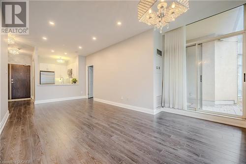 Unfurnished living room with wood-type flooring and sink - 2511 Lakeshore Road W Unit# 108, Oakville, ON - Indoor Photo Showing Other Room