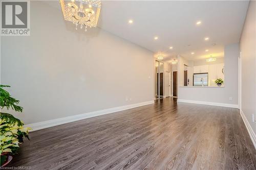 Unfurnished living room with dark hardwood / wood-style flooring - 2511 Lakeshore Road W Unit# 108, Oakville, ON - Indoor Photo Showing Other Room