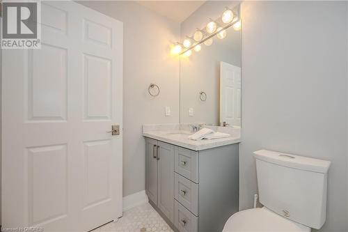 Bathroom with tile patterned floors, vanity, and toilet - 2511 Lakeshore Road W Unit# 108, Oakville, ON - Indoor Photo Showing Bathroom