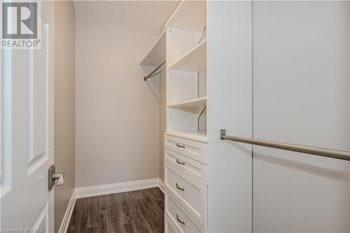 Walk in closet with dark wood-type flooring - 2511 Lakeshore Road W Unit# 108, Oakville, ON - Indoor With Storage