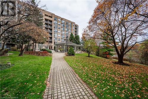 View of property's community featuring a yard and a gazebo - 2511 Lakeshore Road W Unit# 108, Oakville, ON - Outdoor