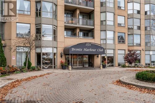 View of building exterior - 2511 Lakeshore Road W Unit# 108, Oakville, ON - Outdoor With Facade