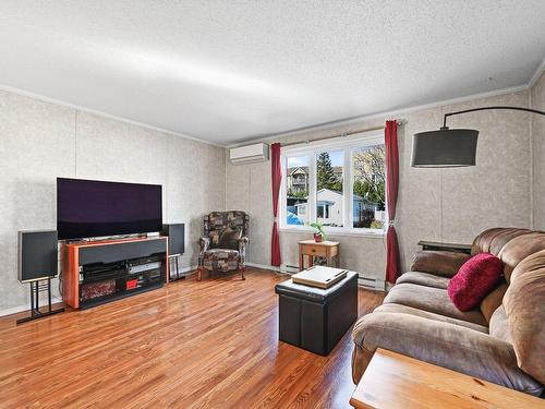 Salon - 121 Rue Modela, Saint-Jean-Sur-Richelieu, QC - Indoor Photo Showing Living Room With Fireplace