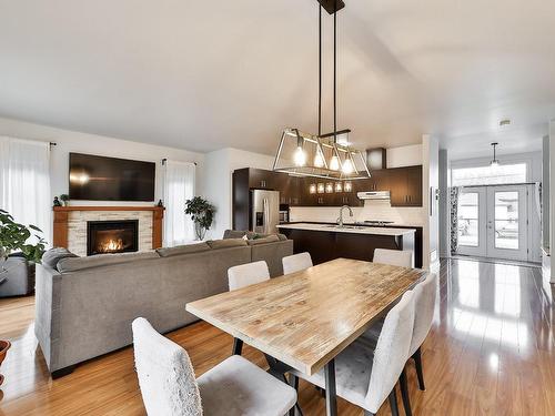 Salle Ã  manger - 728 Rue Alain, Saint-Lin/Laurentides, QC - Indoor Photo Showing Dining Room With Fireplace