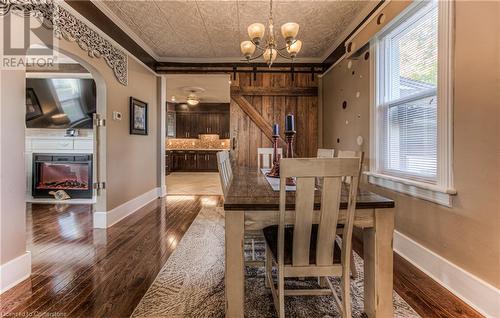 Dining area featuring hardwood / wood-style flooring, plenty of natural light, and ornamental molding - 52 Adam Street, Cambridge, ON - Indoor Photo Showing Dining Room