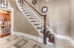 Stairway featuring a chandelier - 