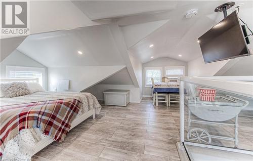 Bedroom with light hardwood / wood-style flooring, multiple windows, and vaulted ceiling - 52 Adam Street, Cambridge, ON - Indoor Photo Showing Bedroom