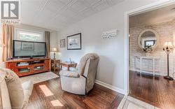 Sitting room with wood-type flooring - 