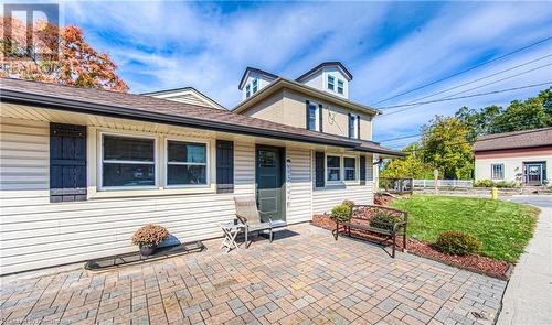 View of front of house with a patio area and a front yard - 52 Adam Street, Cambridge, ON - Outdoor