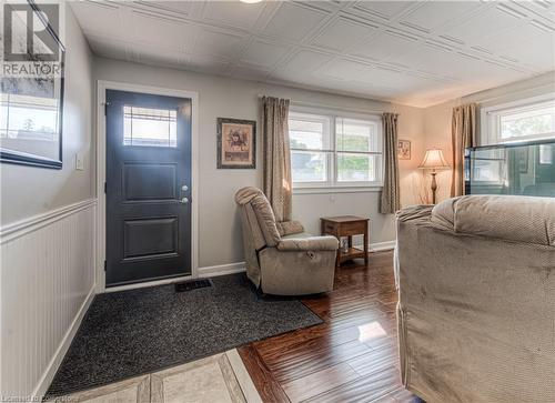 Foyer entrance with dark hardwood / wood-style floors and plenty of natural light - 52 Adam Street, Cambridge, ON - Indoor Photo Showing Bedroom