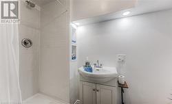 Bathroom featuring walk in shower and vanity - 