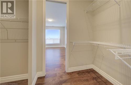 Spacious closet featuring wood-type flooring - 223 Erb Street W Unit# 903, Waterloo, ON - Indoor With Storage