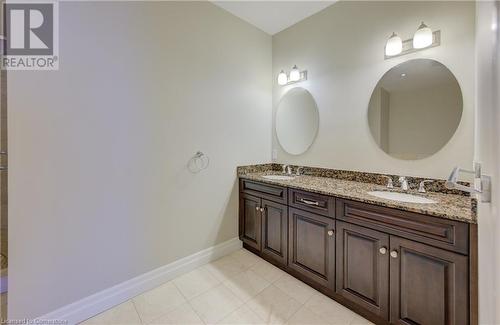 Bathroom featuring tile patterned flooring and vanity - 223 Erb Street W Unit# 903, Waterloo, ON - Indoor Photo Showing Bathroom