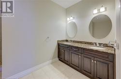 Bathroom featuring tile patterned flooring and vanity - 