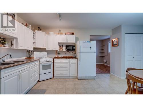 1 Bed Suite Classic White Kitchen - 1811-1813 50 Avenue, Vernon, BC - Indoor Photo Showing Kitchen With Double Sink